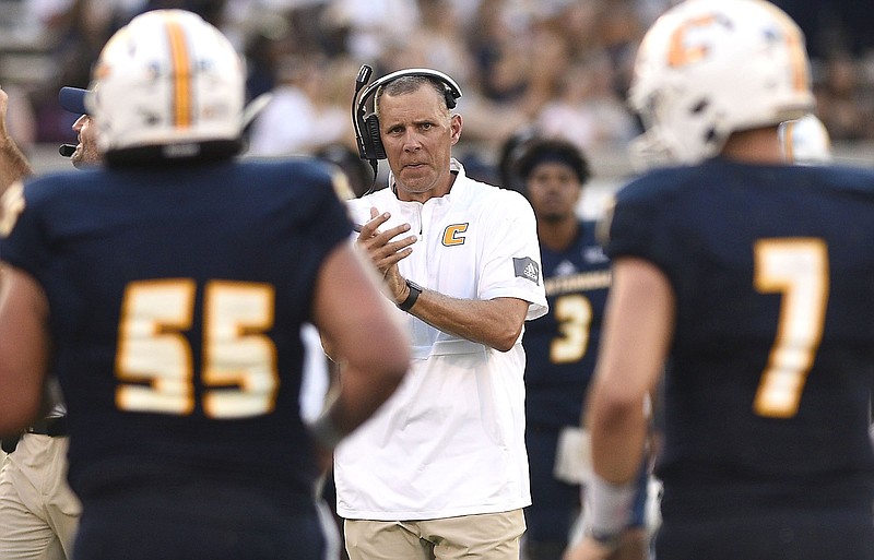 Staff Photo by Robin Rudd/  UTC head coach Rusty Wright congratulates his offense as it comes off the field after a score.  The University of Tennessee at Chattanooga hosted the Western Carolina in a Southern Conference football game on September 28, 2019.  Today was homecoming for UTC. 
