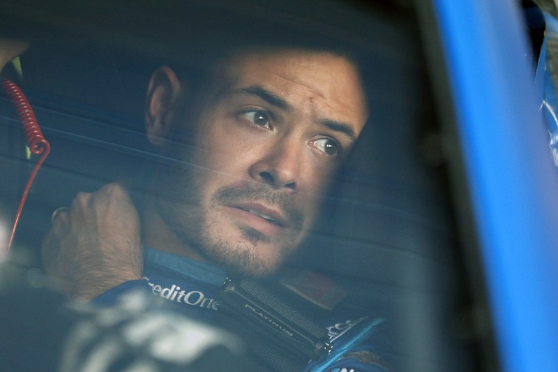 AP photo by Colin E. Braley / Kyle Larson sits in his car before the final practice for a NASCAR Cup Series race at Kansas Speedway on Oct. 18, 2019.