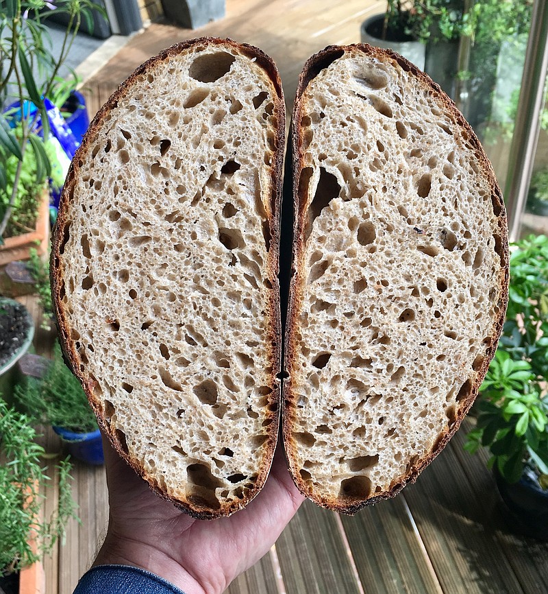 A freshly-baked loaf of sourdough bread appears at a home in London. With millions of people across the globe working at home due to lockdown measures imposed during the coronavirus pandemic, many people are choosing to make their own bread, rather than venturing to the local store to buy their weekly fix. (Matt Kemp via AP)


