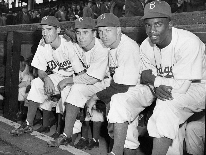 This image features six Brooklyn Dodgers in the dugout of