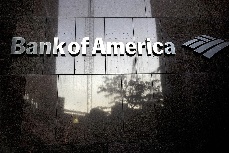 FILE - In this Oct. 14, 2019 file photo a Bank of America logo is attached to the exterior of the Bank of America Financial Center building, in Boston. Bank of America Corp. reports financial results Wednesday, April 15, 2020. (AP Photo/Steven Senne, File)