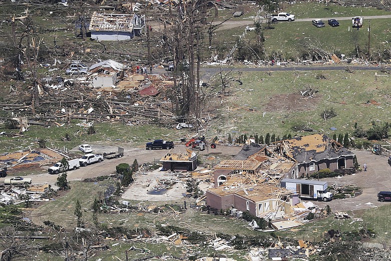 Debris is scattered from damaged homes Tuesday, April 14, 2020, in Chattanooga, Tenn. Tornadoes went through the area Sunday, April 12. (AP Photo/Mark Humphrey)