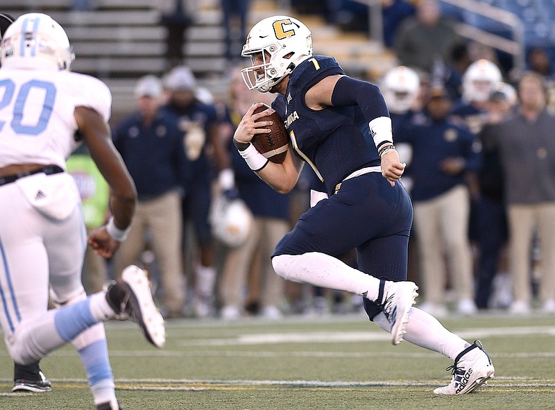 Staff photo by Robin Rudd / UTC quarterback Nick Tiano scrambles for the tying touchdown run in the final seconds of the Mocs' 34-33 comeback win against The Citadel this past Nov. 16 at Finley Stadium. Tiano, a fifth-year senior in the 2019 season, hopes to have the opportunity to play in the NFL, which will hold its annual draft April 23-25.