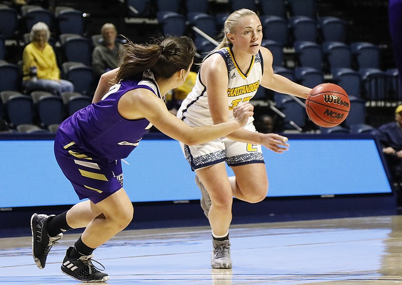 Staff file photo by Troy Stolt / Lakelyn Bouldin, right, a four-year starter for the UTC women's basketball team, was one of 10 athletes who received SoCon postgraduate scholarships this year. UTC golfer Kirsty Beckwith also was among those who earned a grant.