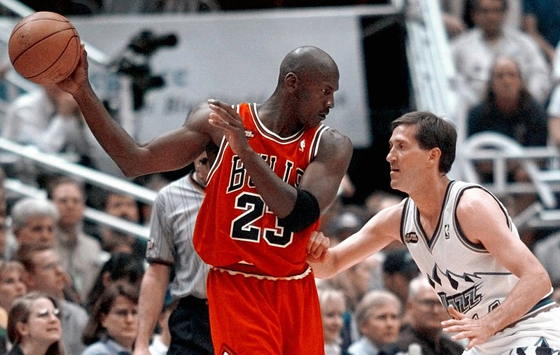 AP photo by Mark J. Terrill / Chicago Bulls superstar Michael Jordan pulls the ball out of reach of Utah Jazz guard Jeff Hornacek during Game 2 of the NBA Finals on June 5, 1998, in Salt Lake City.