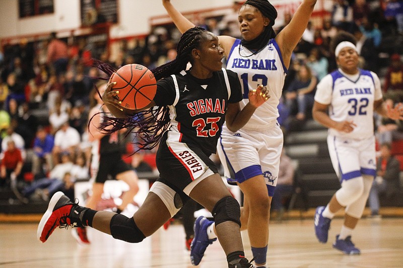 Staff photo by Troy Stolt / Signal Mountain guard Lamiah Walker drives to the basket during the District 6-AA girls' basketball championship game against visiting Red Bank on Feb. 25.