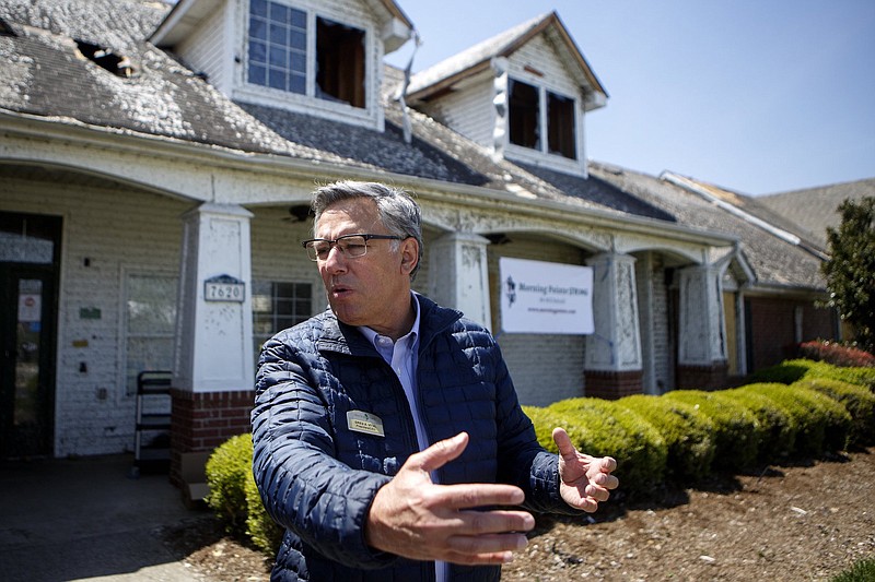 Staff photo by C.B. Schmelter / Morning Pointe Senior Living President Greg A. Vital talks outside The Lantern at Morning Pointe Alzheimer's Center of Excellence Chattanooga on Friday. The facility off of Shallowford Road was hit by the violent storms that tore through Chattanooga.