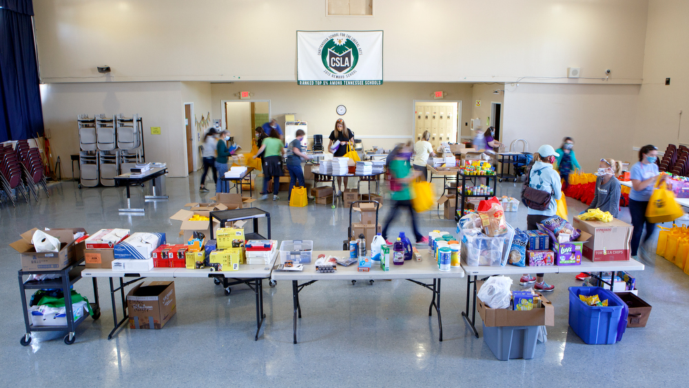 Staff photo by C.B. Schmelter / Teachers and volunteers help pack care packages in the auditorium at Chattanooga School for the Liberal Arts on Monday, April 20, 2020 in Chattanooga, Tenn. Teachers and volunteers made care packages for 250 East Brainerd Elementary students who were displaced by Easter Sunday's tornado. The packages included school materials but also items like Play-Doh, colored pencils and books.