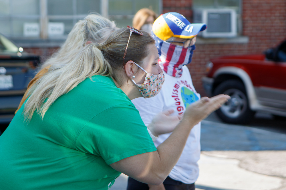 Staff photo by C.B. Schmelter / East Brainerd Elementary kindergarten teacher Jessica Pollard blows a kiss to students as they pick up items at Chattanooga School for the Liberal Arts on Tuesday, April 21, 2020 in Chattanooga, Tenn. Teachers and volunteers made care packages for 250 East Brainerd Elementary students who were displaced by Easter Sunday's tornado. The packages included school materials but also items like Play-Doh, colored pencils and books.