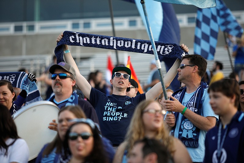 Staff file photo / The Chattahooligans supporters section cheers before Chattanooga Football Club's soccer match against Detroit City FC on April 6, 2019, at Finley Stadium.