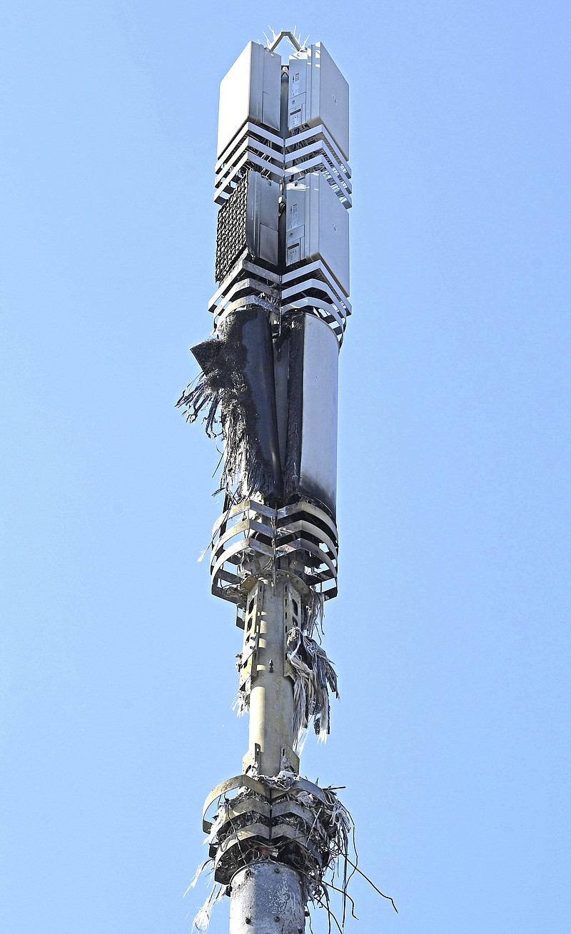 In this Tuesday, April 14, 2020 photo, a view of a cell tower after a fire, in Dagenham, England. Dozens of European cell towers have been destroyed in recent arson attacks that officials and wireless companies say are fueled by groundless conspiracy theories linking new 5G mobile networks and the coronavirus pandemic. (Stefan Rousseau/PA via AP)


