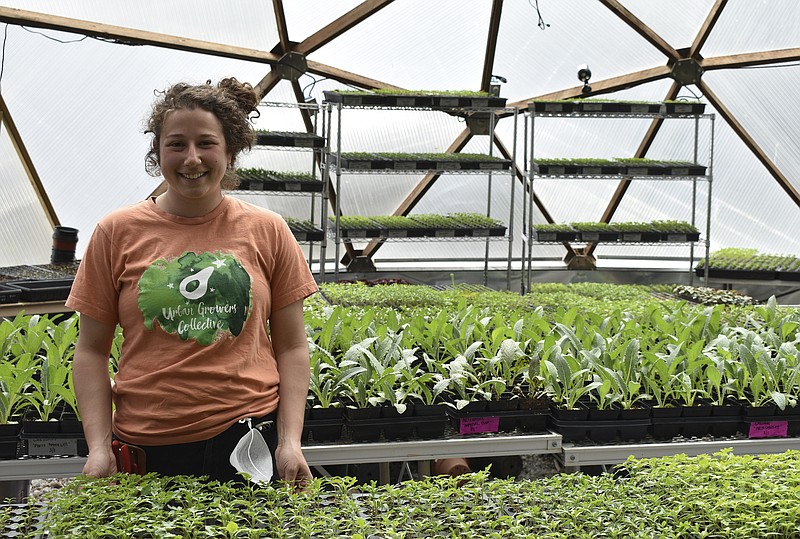 This April 10, 2020 photo shows Allison Sturm, Urban Farm Assistant, at the Urban Growers Collective farm in Chicago. The nonprofit teaches young kids and others to grow vegetables at eight urban farms around the city. While their spring educational programs are on hold due to rules on social distancing, Laurell Sims, the co-founder, said they are still focusing on food production and getting produce to families that need it. (Laurell Sims via AP)

