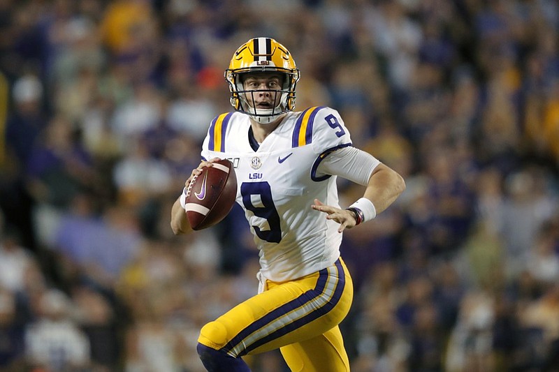 FILE - In this Nov. 30, 2019, file photo, LSU quarterback Joe Burrow (9) scrambles during the first half of an NCAA college football game against Texas A&M in Baton Rouge, La. Burrow is a possible first round pick in the NFL Draft Thursday night, April 23, 2020. (AP Photo/Gerald Herbert, File)