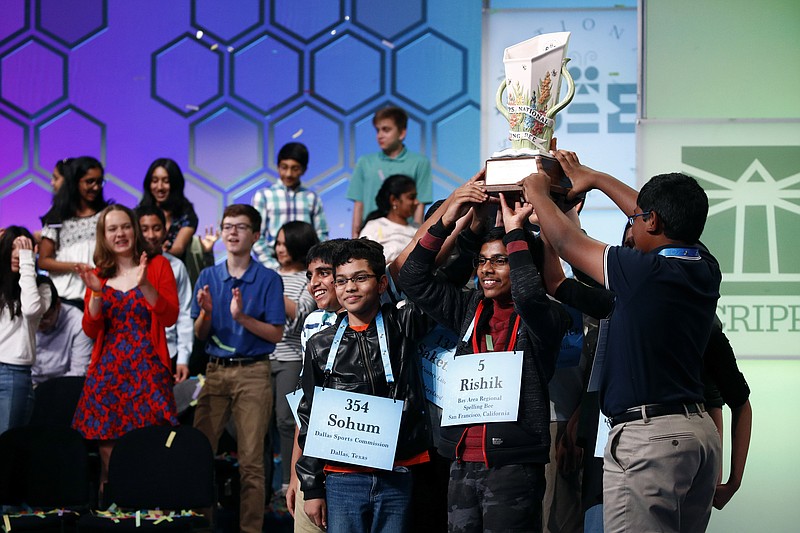 FILE - In this May 31, 2019 file photos, eight co-champions celebrate after winning the Scripps National Spelling Bee, in Oxon Hill, Md. The Scripps National Spelling Bee has been canceled after organizers concluded there was "no clear path to safely set a new date in 2020" because of the coronavirus pandemic. (AP Photo/Patrick Semansky)


