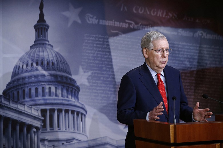 Senate Majority Leader Mitch McConnell of Ky., speaks with reporters after the Senate approved a nearly $500 billion coronavirus aid bill, Tuesday, April 21, 2020, on Capitol Hill in Washington. (AP Photo/Patrick Semansky)