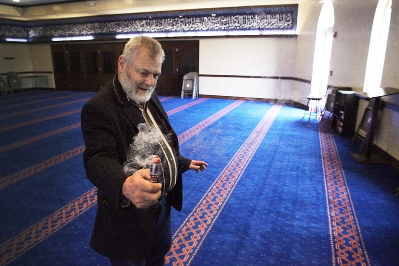 Staff photo by Wyatt Massey / Sadek Alsouqi, the imam at the Islamic Society of Greater Chattanooga, spreads incense in the mosque on April 22, 2020. Thursday marks the beginning of the holy month of Ramadan but much of the month will be celebrated in homes as concerns about COVID-19 ended in-person gatherings.