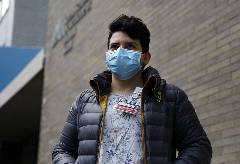 In this April 16, 2020 photo. Mount Sinai chaplain Silvia Mejia stands outside of the hospital in New York. Mejia, who is one of many young spiritual counselors helping families cope with the coronavirus pandemic, says, "This feels bigger than a job right now. It feels like a purpose." (AP Photo/Jessie Wardarski)


