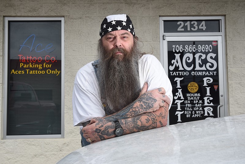 Staff photo by Tim Barber/ Al Creamer stands in front of his Aces Tattoo Company shop Thursday on LaFayette Road in Fort Oglethorpe. Apr. 23, 2020.
