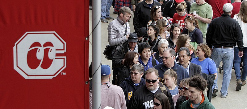 Staff photo by C.B. Schmelter / Baseball fans line up to get into AT&T Field before the Chattanooga Lookouts' season opener against the Birmingham Barons on April 5, 2018.