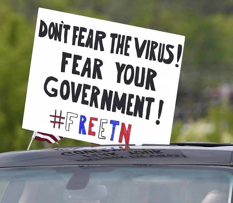 Staff Photo by Robin Rudd / Some protesters drove their cars repeatedly across the Market Street Bridge in Chattanooga last week during a "Freedom Rally" to protest governmental closure orders during the COVID-19 pandemic.