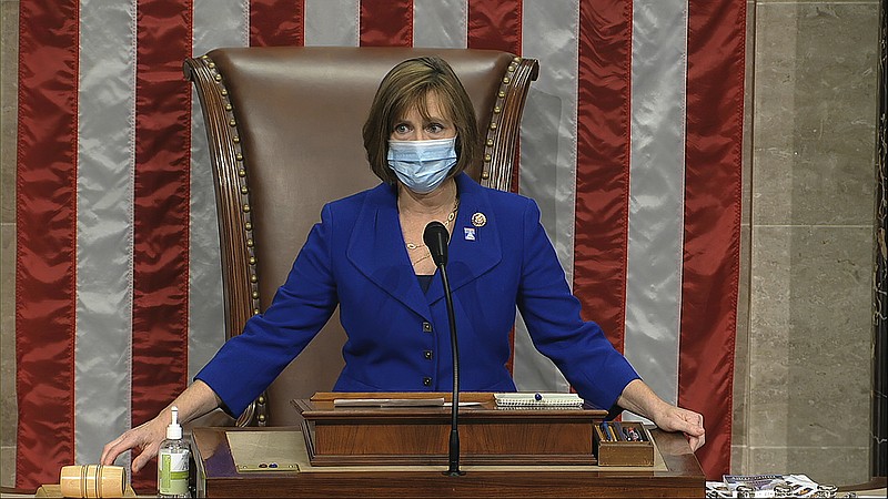 In this image from video, Rep. Kathy Castor, D-Fla., sits in the chair and leads the House on the floor of the House of Representatives at the U.S. Capitol in Washington, Thursday, April 23, 2020. (House Television via AP)


