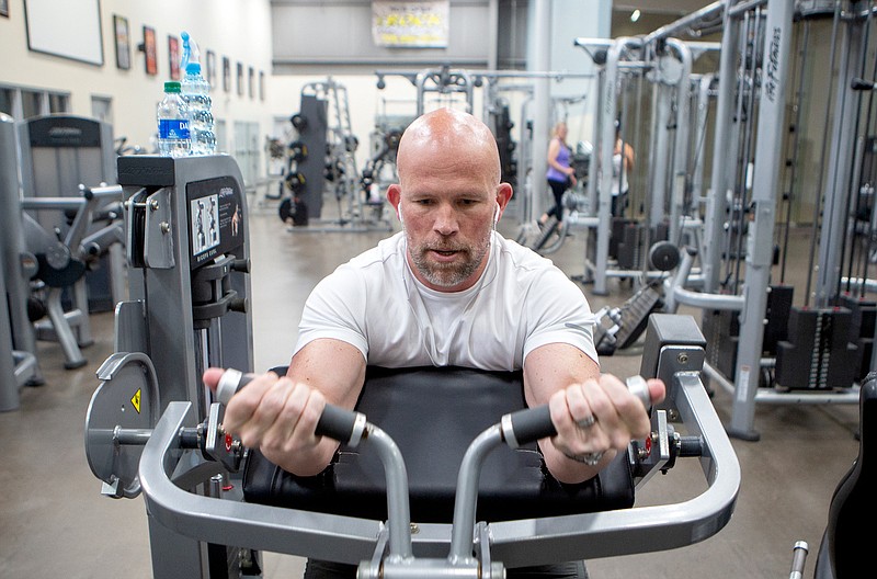 Staff photo by C.B. Schmelter / Noah Nichols works out at the Rock Fitness Center on Friday, April 24, 2020 in Ringgold, Ga. Gyms, along with hair salons, bowling alleys and tattoo parlors were among the businesses allowed to open on Friday.