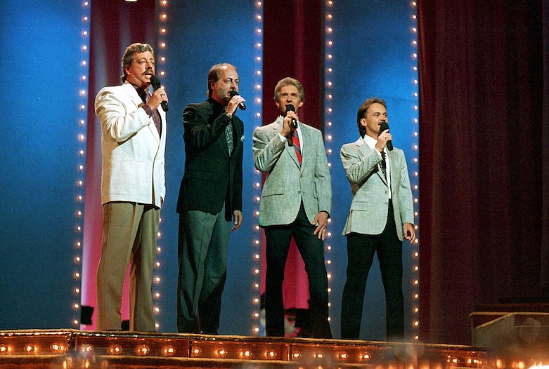 In this June 5, 1989, file photo, The Statler Brothers, from left, Harold Reid, Don Reid, Phil Balsley and Jimmy Fortune, perform at the 23rd annual Music City News Country Awards show in Nashville, Tenn. Harold Reid, who sang bass for the Grammy-winning country group The Statler Brothers, died Friday, April 24, 2020, after a long battle with kidney failure. He was 80. (AP Photo/Mark Humphrey, File)