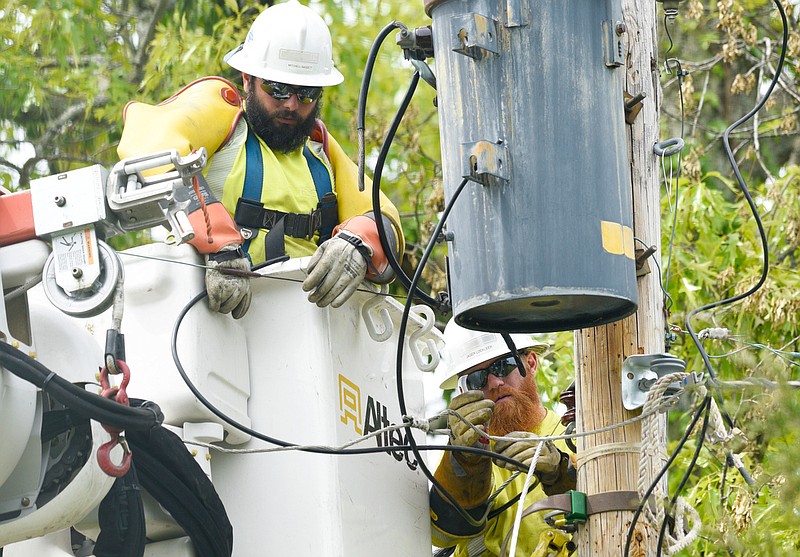 Staff Photo by Robin Rudd / A crew from Chattanooga's Service Electric Company works to restore power on Davidson Road in East Brainerd on April 22, 2020.  

