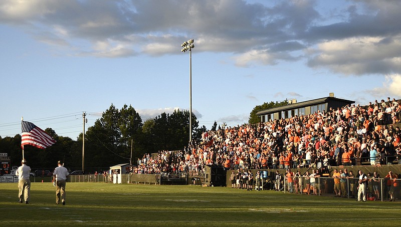 Staff photo by Robin Rudd / The Meigs County Veterans Committee Color Guard brings the U.S. flag onto Jewell Field before Meigs County High School's football game against Rockwood on Sept. 14, 2018, in Decatur, Tenn. After losing part of the basketball postseason and almost the entire spring sports season this year because of the COVID-19 pandemic, it's even more crucial for the TSSAA and its member schools to have football this fall.