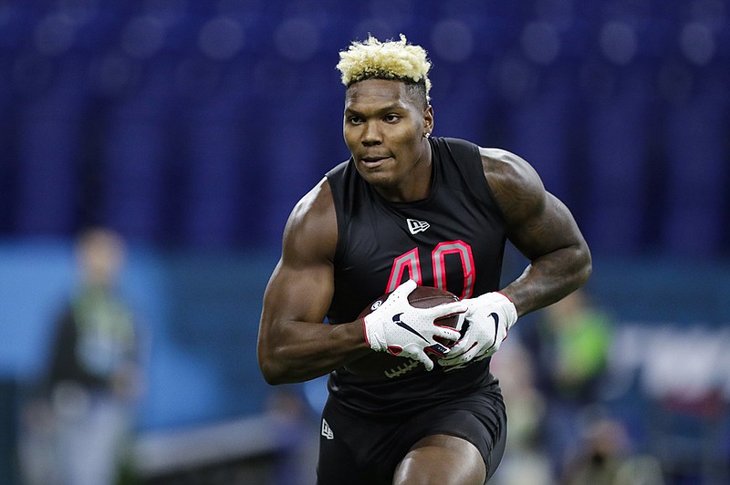 AP photo by Michael Conroy / Fresno State linebacker Mykal Walker runs a drill at the NFL scouting scouting combine on Feb. 29 in Indianapolis.