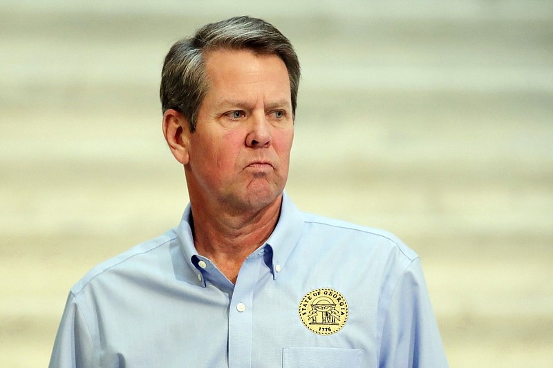 FILE - In this Wednesday, April 8, 2020, file photo, Georgia Gov. Brian Kemp walks away after speaking during a news conference at the state Capitol in Atlanta. Kemp attracted widespread attention, criticism and even derision when he announced this week the resumption of elective medical procedures, as well as the reopening of certain close-contact businesses like gyms, barbershops and tattoo parlors. Kemp got no public pushback from Public Health Commissioner Kathleen Toomey, whom he appointed, but was criticized widely by public health experts at Georgia universities. (AP Photo/Brynn Anderson, File)