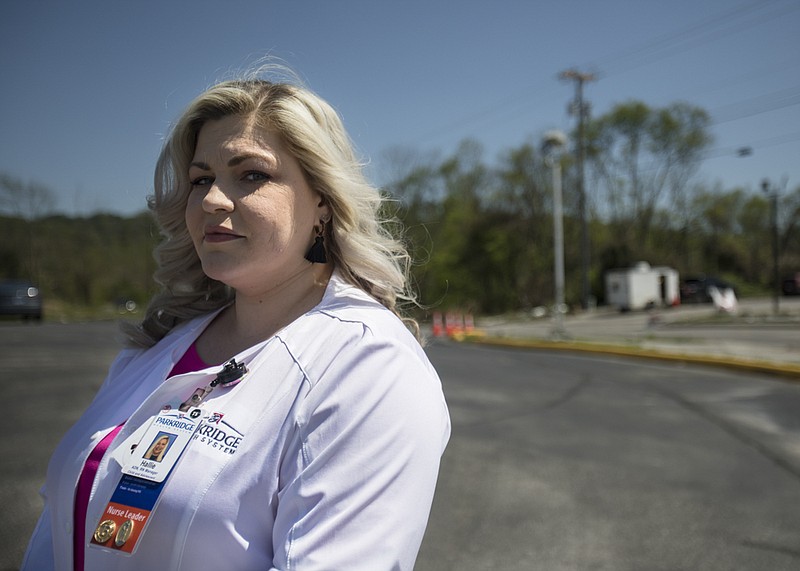 Staff photo by Troy Stolt / Parkridge Valley Child and Adolescent campus nurse manager Hallie Bailey stands for a portrait at the BP station located at the corner of Jenkins and Shallowford Road on Monday, April 27, 2020 in East Brainerd, Tenn. On March 13, just hours after an EF3 tornado tore through East Brainerd, Bailey and her colleague Greg Partin walked a mile and a half through wreckage from The Lantern at Morning Pointe Alzheimer's Center of Excellence Chattanooga to Parkridge Valley Child and Adolescent campus because roads were shut down. The commute normally takes Bailey eight minutes.