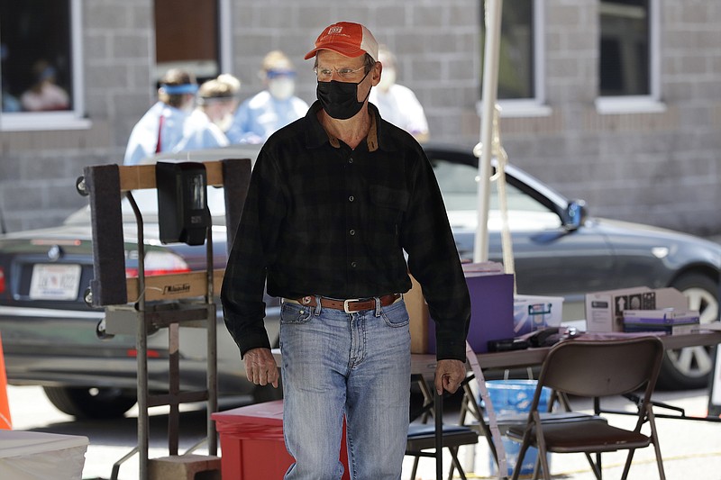 Photo by Mark Humphrey of The Associated Press / Tennessee Gov. Bill Lee visits a drive-through COVID-19 testing location on Saturday, April 18, 2020, in Franklin, Tennessee. An expanded testing effort launched in Tennessee Saturday includes workers from the Tennessee National Guard at 15 drive-through testing sites across the state.