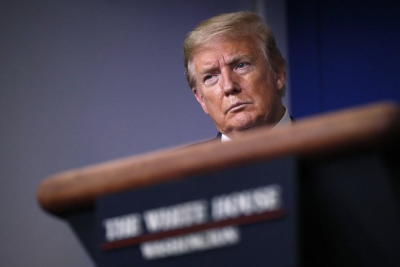 In this April 22, 2020, file photo, President Donald Trump listens during a briefing about the coronavirus in the James Brady Press Briefing Room of the White House, in Washington. After two months of frantic response to the coronavirus pandemic, the White House is planning to shift President Trump's public focus to the burgeoning efforts aimed at easing the economic devastation. (AP Photo/Alex Brandon, File)