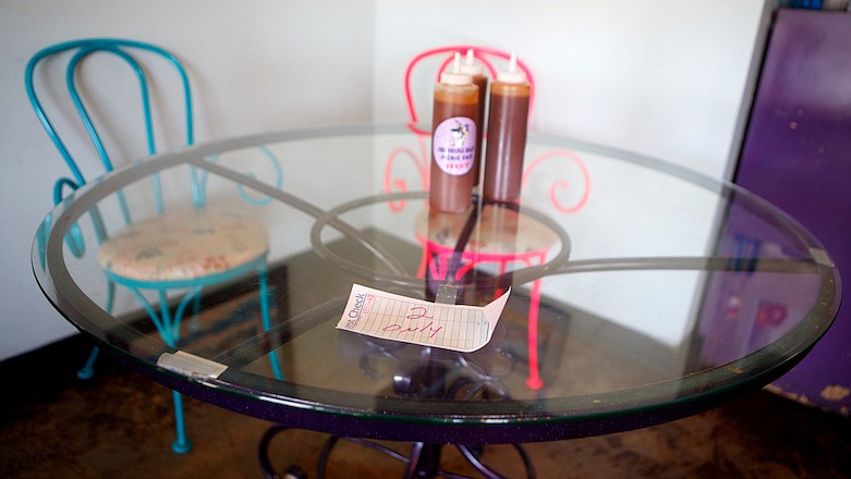 Staff photo by C.B. Schmelter / A table set for specifically two diners is seen at Purple Daisy Picnic Cafe on Monday, April 27, 2020 in Chattanooga, Tenn. Restaurants around Chattanooga began to reopen following the shutdown due to the coronavirus.