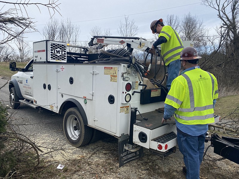 Photo contributed by Tennessee American Water Company / TAWC employees Mickey Bates and Travis Griffith deliver a portable generator in Mt. Juliet, Tennessee, after the March 2020 tornadoes.