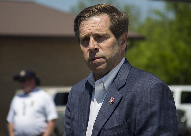 Staff photo by Troy Stolt / U.S. Rep. Chuck Fleischmann, R-Tennessee, speaks with Bradley County law enforcement  on Thursday, April 16, 2020, before heading out on a tour of areas in Cleveland that were hit by a tornado on Sunday, April 12.