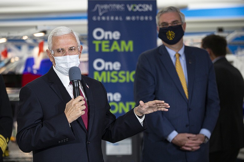 Vice President Mike Pence speaks during a visit to the General Motors/Ventec ventilator production facility with Indiana Gov. Eric Holcomb in Kokomo, Ind., Thursday, April 30, 2020. (AP Photo/Michael Conroy)