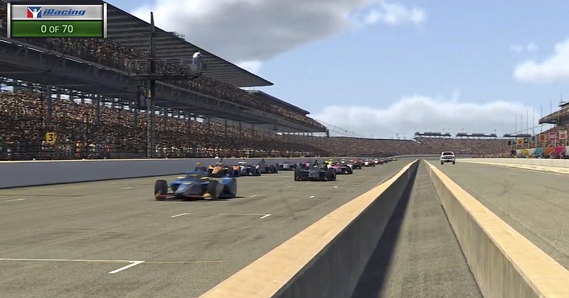 IndyCar iRacing video still via AP / IndyCar driver Scott McLaughlin, left, leads the field as the green flag drops during Saturday's First Responder 175 presented by GMR race at virtual Indianapolis Motor Speedway.