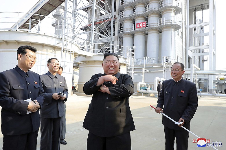 In this Friday, May 1, 2020, photo provided by the North Korean government, North Korean leader Kim Jong Un, center, visits a fertilizer factory in Sunchon, South Pyongan province, near Pyongyang, North Korea. Kim made his first public appearance in 20 days as he celebrated the completion of the fertilizer factory, state media said Saturday, May 2, 2020, ending an absence that had triggered global rumors that he may be seriously ill. Independent journalists were not given access to cover the event depicted in this image distributed by the North Korean government. The content of this image is as provided and cannot be independently verified. Korean language watermark on image as provided by source reads: "KCNA" which is the abbreviation for Korean Central News Agency. (Korean Central News Agency/Korea News Service via AP)