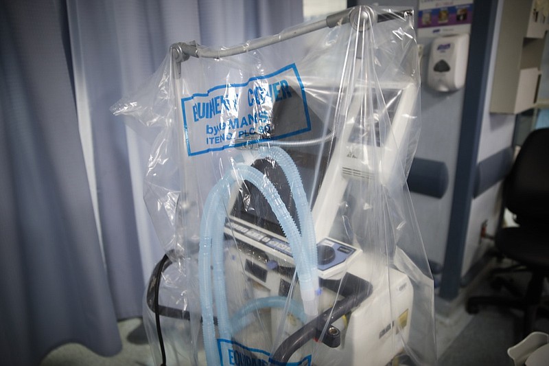 FILE - In this April 20, 2020, file photo a ventilator waits to be used for a COVID-19 patient going into cardiac arrest at St. Joseph's Hospital in Yonkers, N.Y. COVID-19 could have stamped someone "uninsurable"  if not for the Affordable Care Act. The ban on insurers using preexisting conditions to deny coverage is a key part of the Obama-era law that the Trump administration still seeks to overturn. (AP Photo/John Minchillo, File)