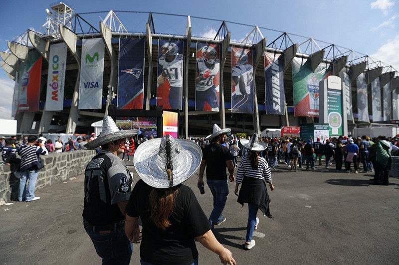 AP photo by Eduardo Verdugo / Fans arrive at Estadio Azteca before an NFL game between the Oakland Raiders and the New England Patriots on Nov. 19, 2017, in Mexico City.