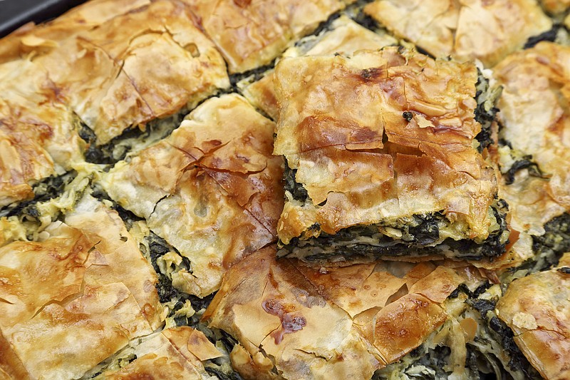 freshly baked spinach pie closeup spinach pie tile food tile / Getty Images
