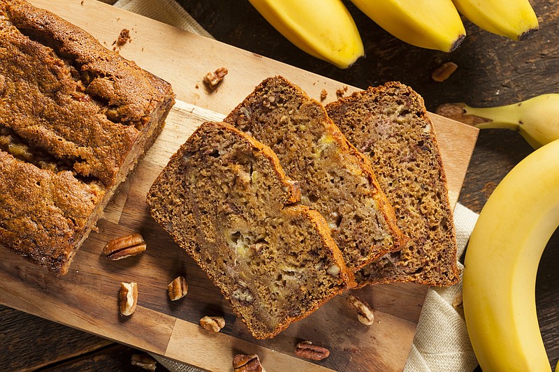 Homemade Banana Nut Bread Cut into Slices banana bread tile food tile / Getty Images
 