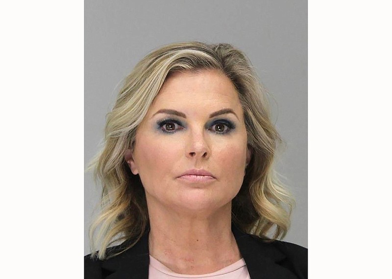 This Tuesday, May 5, 2020 booking photo provided by the Dallas County Sheriff's Office shows Shelly Luther. Luther was ordered to spend a week in jail after she continued to operate her business despite being issued a citation last month for keeping open her Dallas salon due to restrictions put in place because of the coronavirus pandemic. Luther's hearing occurred as Texas Gov. Greg Abbott relaxed more restrictions statewide, allowing barbershops and hair salons to reopen Friday. (Dallas County Sheriff's Office via AP)