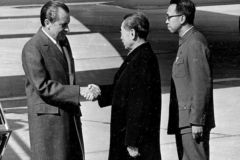 In this Feb. 21, 1972, file photo, Ji Chaozhu, right, stands near then Chinese Premier Zhou Enlai, center, greeting then U.S. President Richard Nixon at Beijing Airport in Beijing. Ji, a veteran Chinese diplomat who provided English translation for leaders from Mao Zedong to Deng Xiaoping and served as an undersecretary of the United Nations, has died on April 29 in Beijing, the foreign ministry said late Wednesday, May 6, 2020. He was 90. (AP Photo, File)