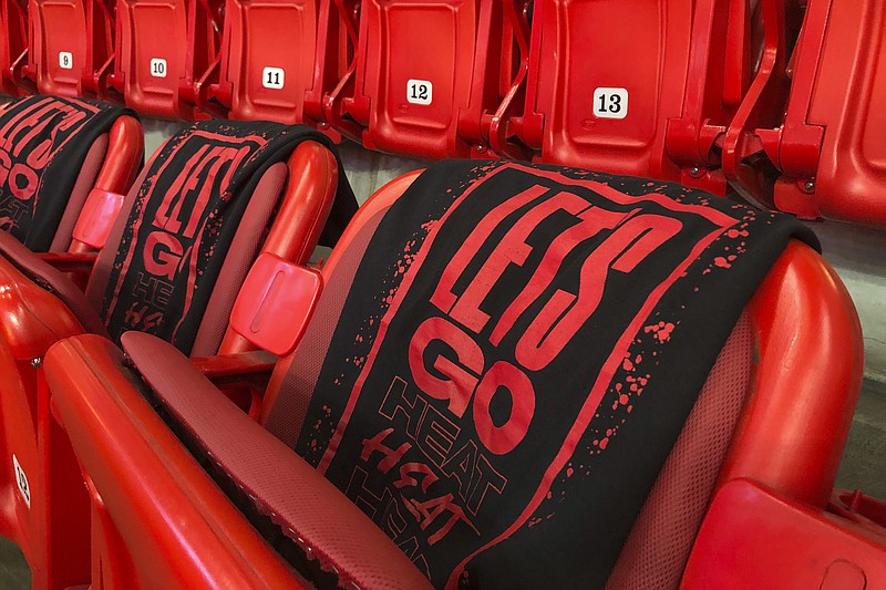 AP photo by Brynn Anderson / "Let's Go Heat" is displayed on T-shirts in the stands before a Miami Heat game against the visiting Memphis Grizzlies on Oct. 23, 2019.