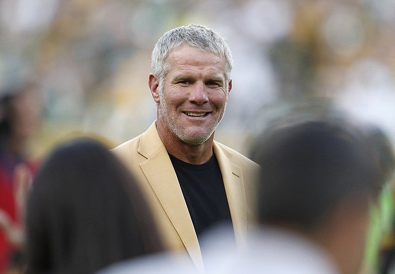 AP photo by Matt Ludtke / Pro Football Hall of Fame quarterback Brett Favre smiles during a halftime ceremony of a game between the Dallas Cowboys and the host Green Bay Packers on Oct. 16, 2016.