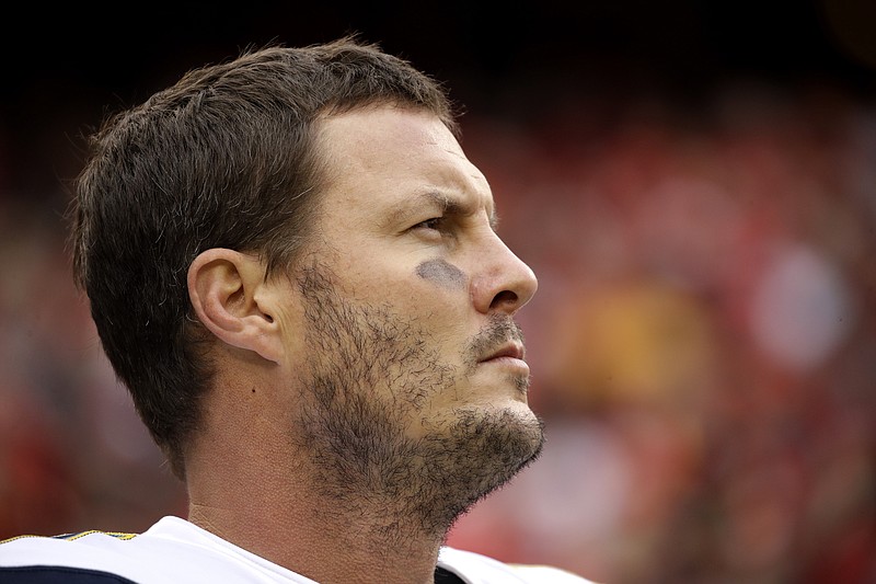 AP photo by Charlie Riedel / Los Angeles Chargers quarterback Philip Rivers stands for the national anthem before a road agame against the Kansas City Chiefs on Dec. 29, 2019. Rivers has signed a one-year contract with the Indianapolis Colts.