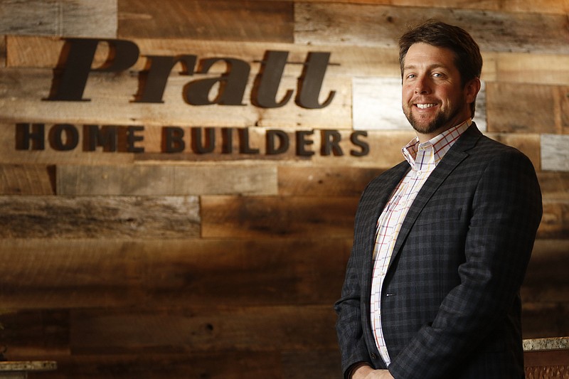 James "Win" Pratt III stands in his company's showroom. Pratt is proposing to redevelop the former Quarry golf course near Mountain Creek and Reads Lake roads into a new planned unit development. Staff file photo by Dan Henry / 